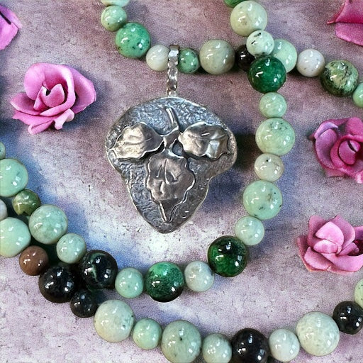 Sterling Silver Leaf and Green Garnet Necklace Set. $65