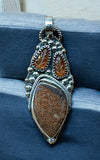 Dinosaur Bone and Kyanite  sterling silver pendant.      $70