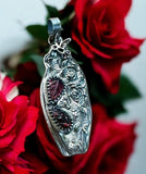 Carved Garnet Sterling Silver Rose Pendant.   $75