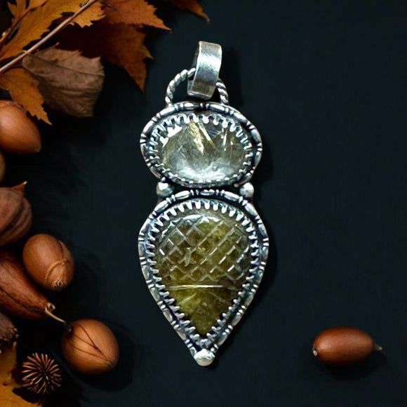 Carved Tourmaline and Gold Rutile Quartz pendant.  $55