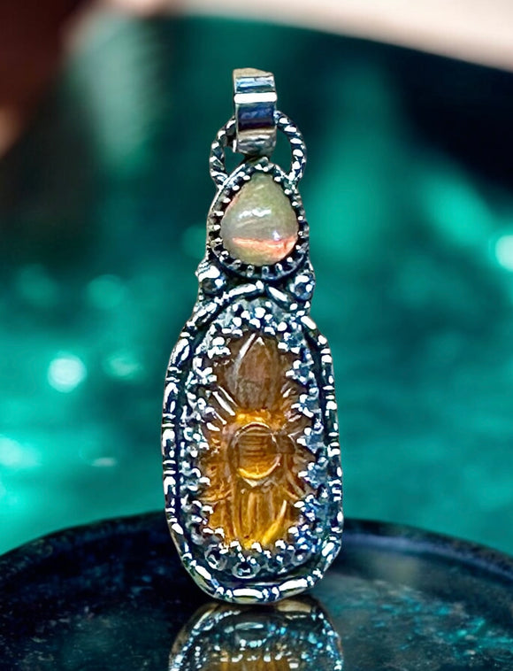 Carved Kyanite and Ethiopian Opal Sterling Silver Pendant.  $60