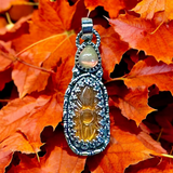 Carved Kyanite and Ethiopian Opal Sterling Silver Pendant.  $60