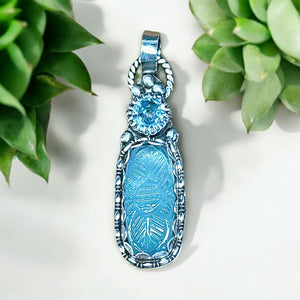 Carved Aquamarine and Topaz Sterling Silver Pendant.   $60