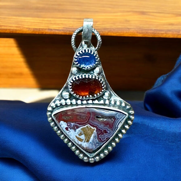 Crazy Lace Agate , Garnet and Tanzanite Sterling silver pendant.    $70