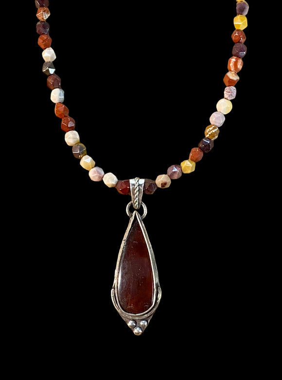 Amber sterling silver pendant and matching gemstone necklace.   $55