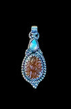 Carved Kyanite and Ethiopian Opal Sterling Silver Pendant.  $65