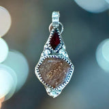 Sunstone and Garnet Sterling Silver Pendant.   $55