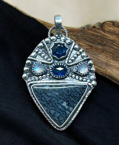 Blue Dinosaur Bone, kyanite , rainbow moonstone and sapphire sterling silver pendant      $75