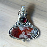 Crazy Lace Agate and Garnet sterling silver pendant.      $65