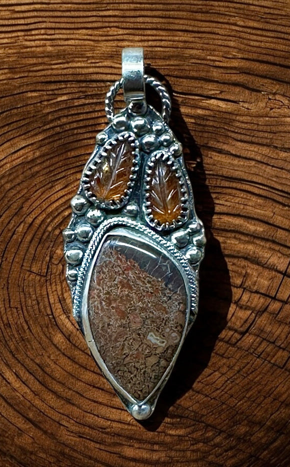 Dinosaur Bone and Kyanite  sterling silver pendant.      $70