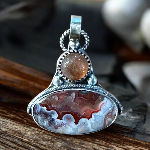 Crazy Lace Agate and Sunstone sterling silver pendant.      $65