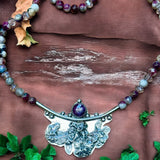 Sapphire sterling silver floral pendant and matching tourmaline gemstone necklace.      $90