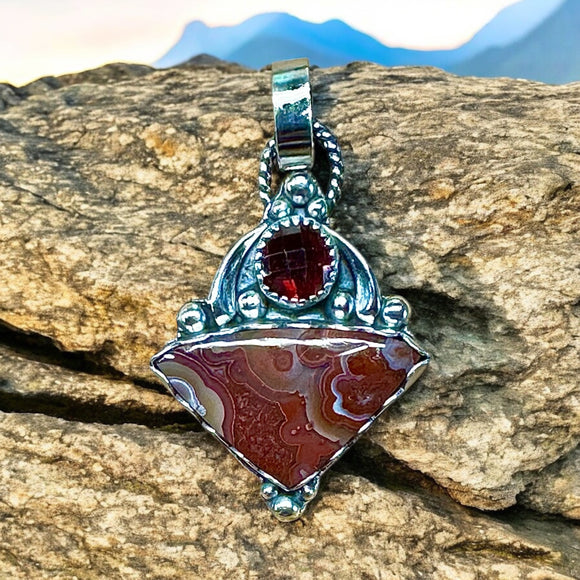 Crazy Lace Agate and Garnet sterling silver pendant.      $70