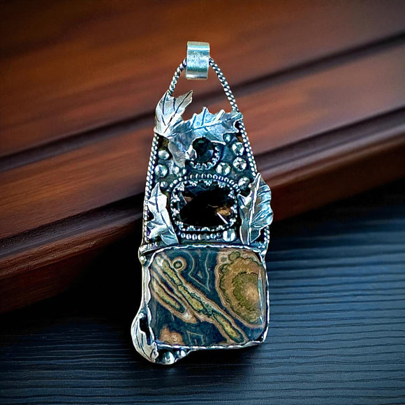 Flowering Tube Onyx , Smoky Quartz and Montana agate Leaf sterling silver pendant.   $80