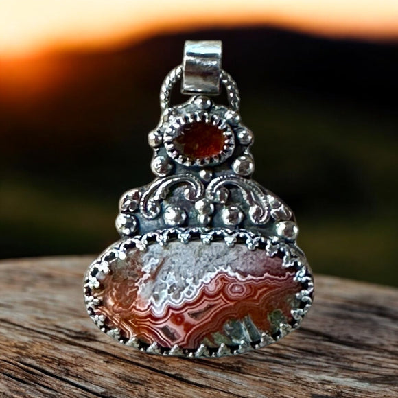 Crazy Lace Agate and Garnet Sterling Silver Pendant.     $75