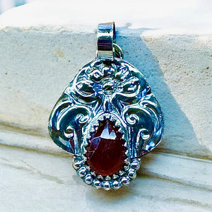 Garnet Floral Sterling Silver Pendant     $65