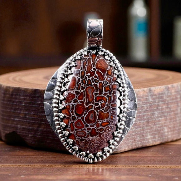 Red Dinosaur Bone Sterling Silver Pendant.   $90