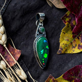 Ethiopian Black/Green 6.5 Carat and Emerald Sterling Silver Pendant     $200