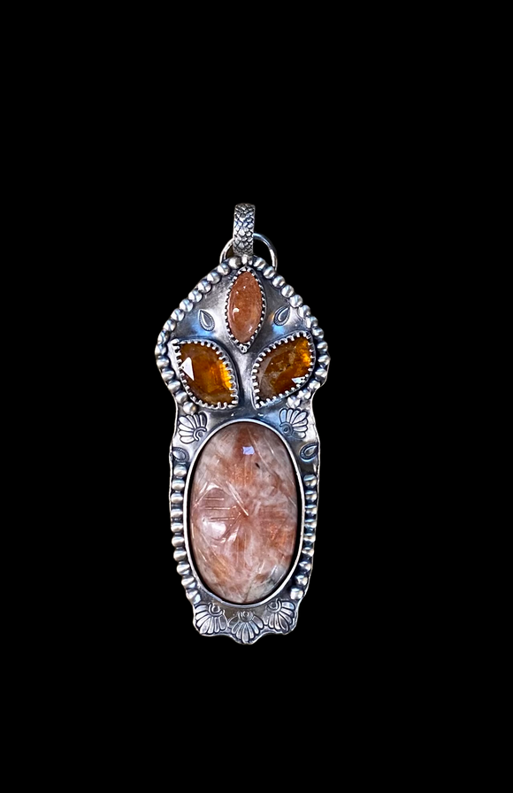 Carved Sunstone and Kyanite large sterling silver pendant.    $75