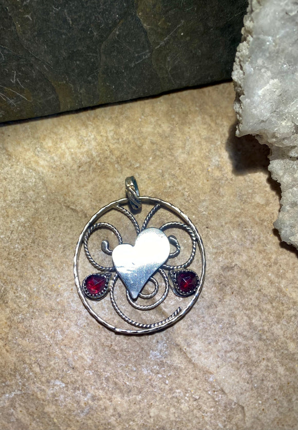 Garnet and Heart sterling silver pendant. $60