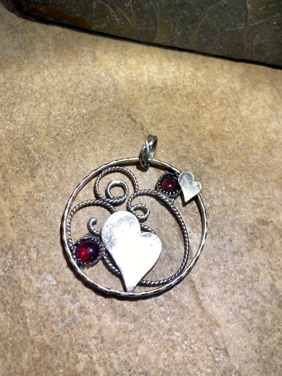 Garnet and Heart sterling silver pendant.   $60